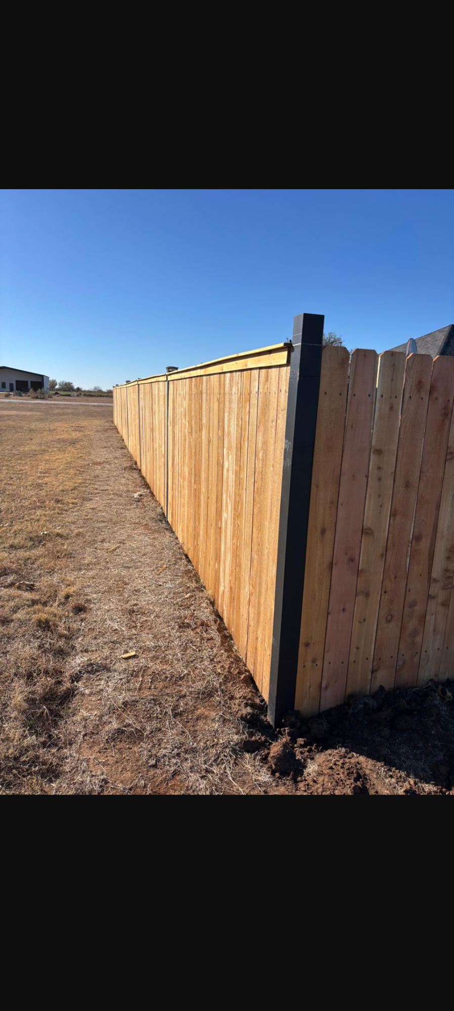 Fence long view — West Texas sky